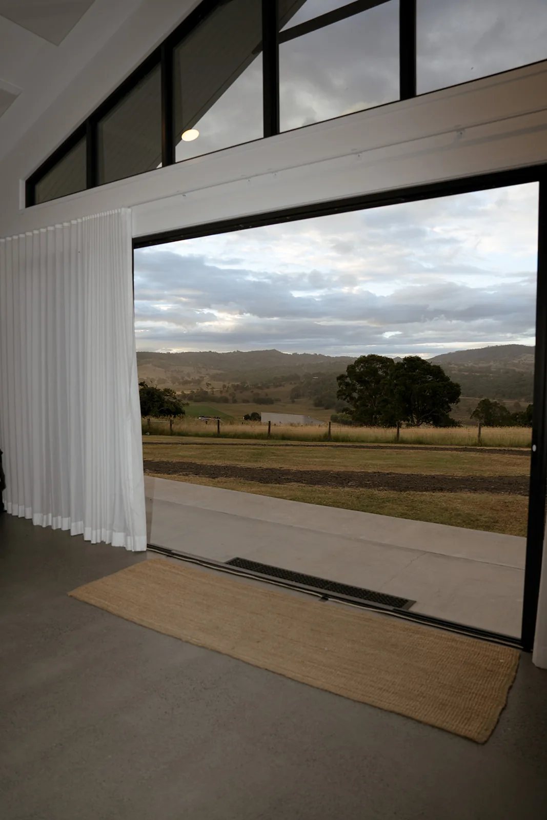 Black and white view through the reception doors overlooking the Scenic Rim countryside