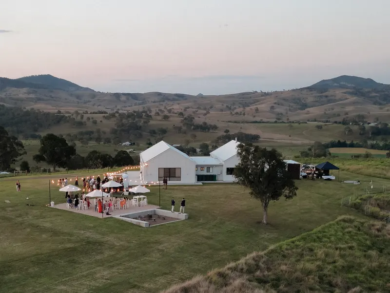 The cocktail area with festoon lighting and mountain views
